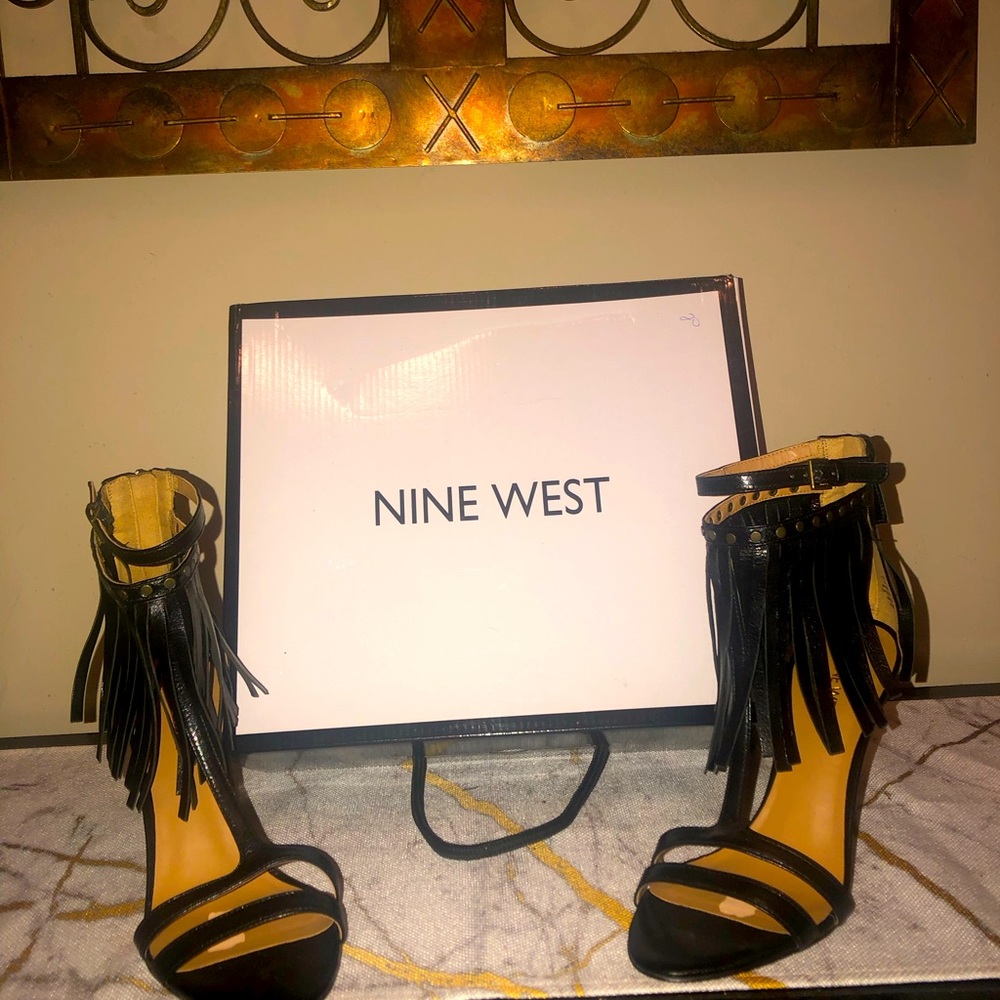 Black heels; sexy, sassy and very classy; with fringe detail around the ankle